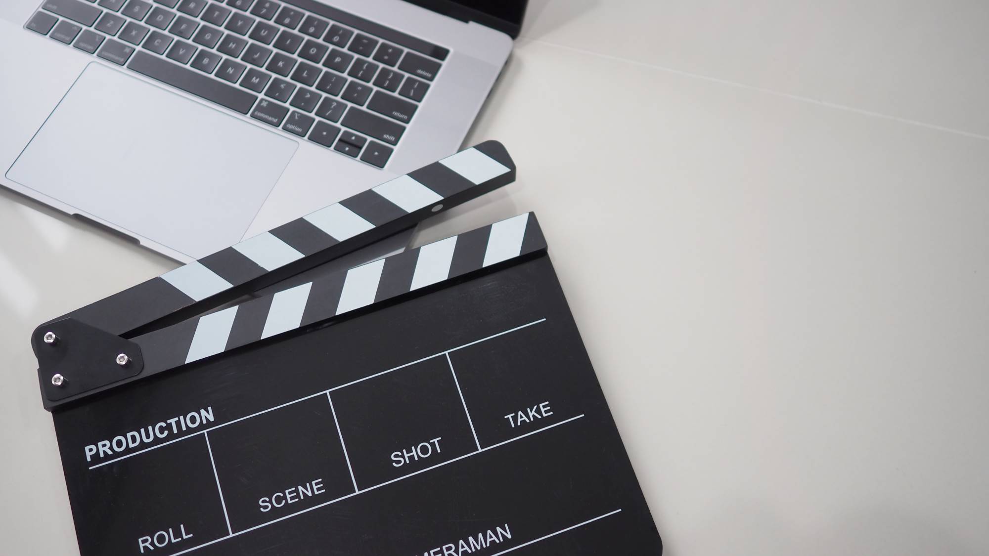 clapperboard and laptop