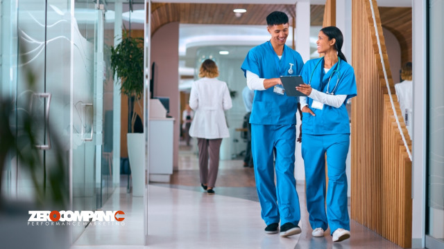 Doctors or Nurses In Scrubs With Digital Tablet In Hospital