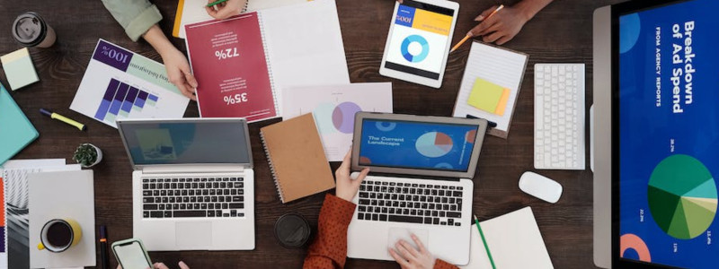 a group of people discussing charts