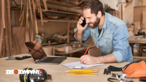 young handyman man using laptop computer